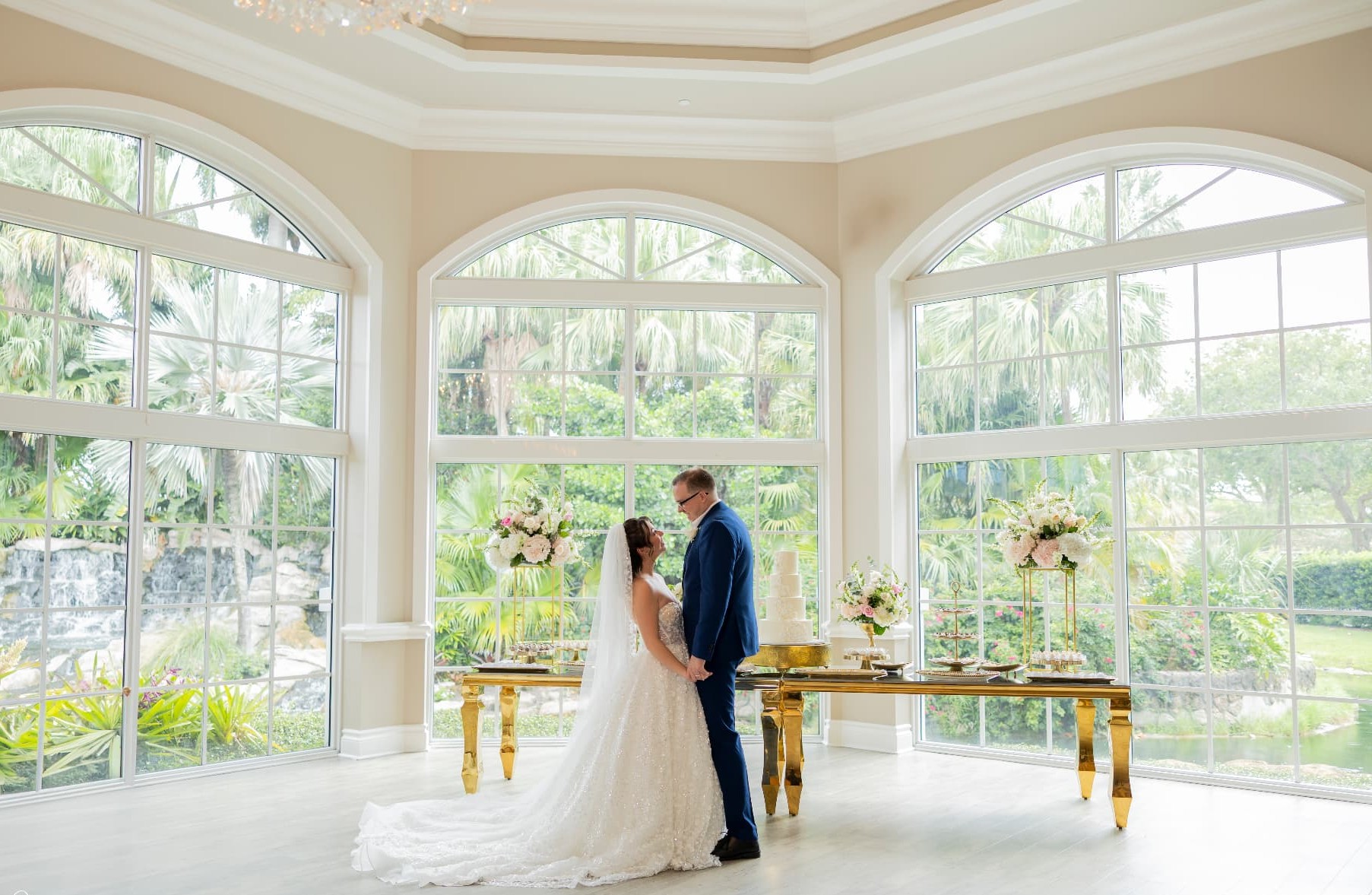 A bride and groom sharing a quiet moment in a light-filled South Florida venue